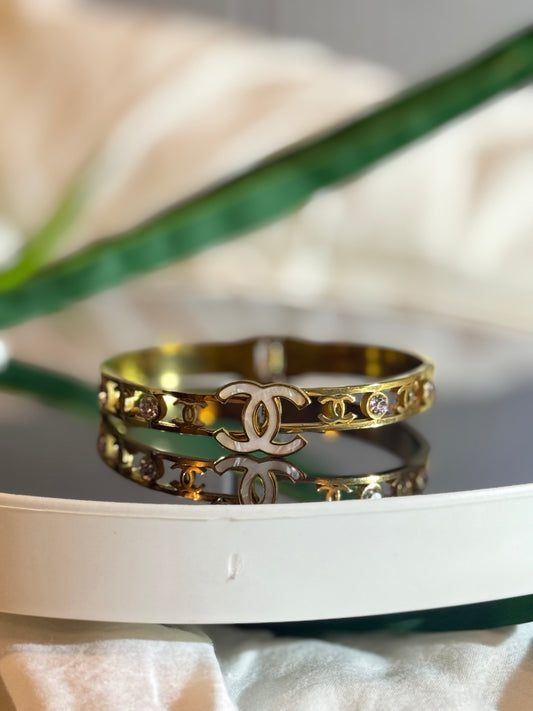 Golden luxe emblem cuff